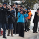 People react as a helicopter carrying US president Donald Trump lands in Davos on Jan. 25.